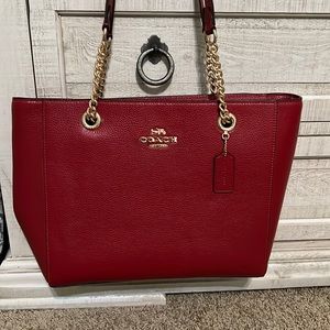 New, never used Coach purse, red